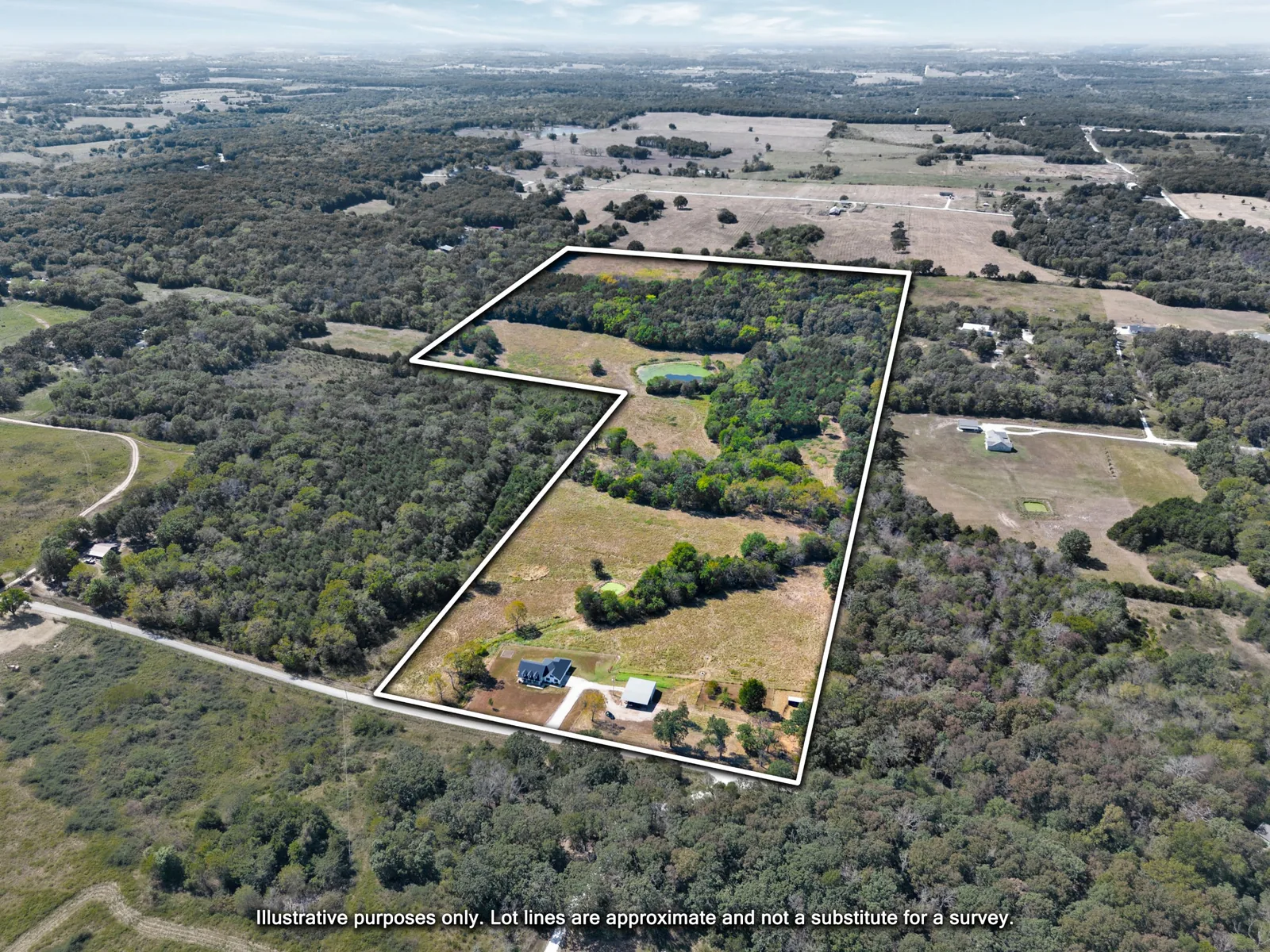 Aerial photo with approximate property lines drawn around the home, pasture, pond and woods