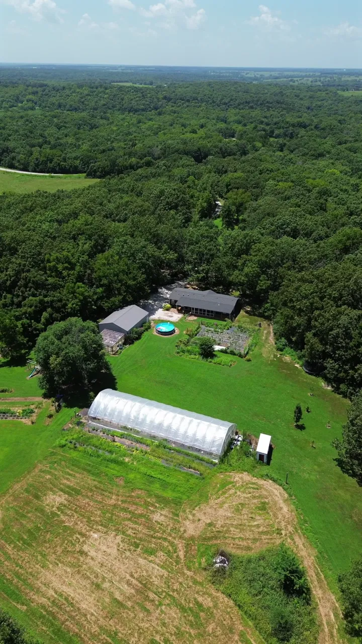 Vertical reel of a homestead on acreage, with aerials